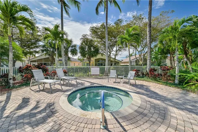 a view of a swimming pool with sitting area