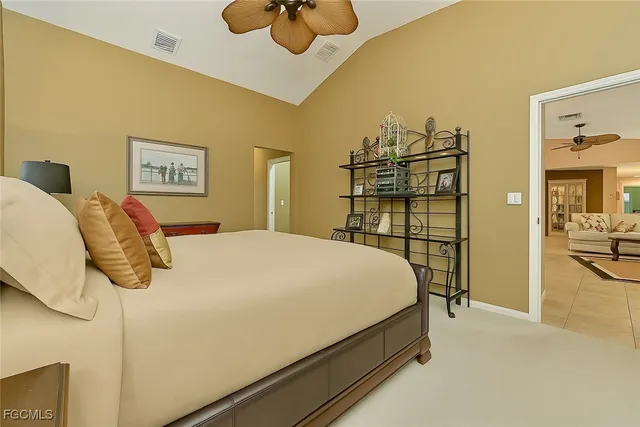 a bedroom with a bed and a view of bathroom