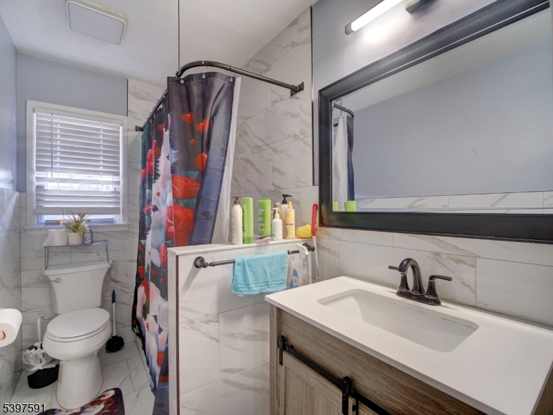 221 Chincopee Avenue Hopatcong, NJ 07843 - Photo 12 of 20 a bathroom with a sink toilet and shower