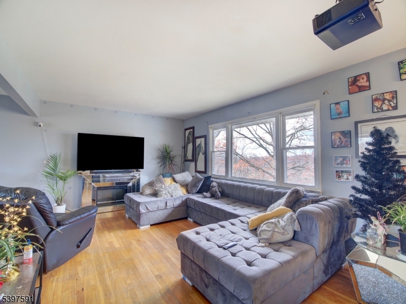 221 Chincopee Avenue Hopatcong, NJ 07843 - Photo 3 of 20 a living room with furniture and a flat screen tv