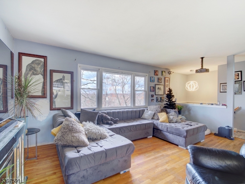 221 Chincopee Avenue Hopatcong, NJ 07843 - Photo 4 of 20 a living room with furniture and a large window