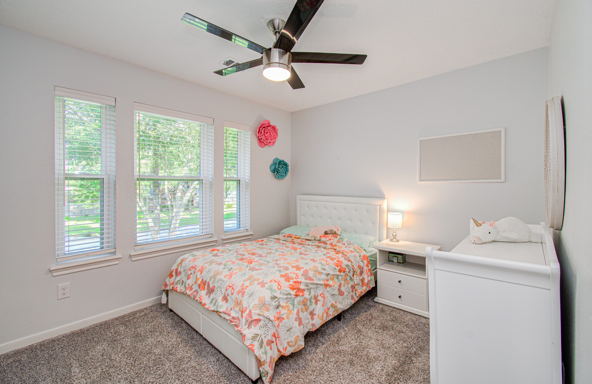 22927 Northoak Forest Lane Spring, TX 77389 - Photo 21 of 37 a bedroom with a bed and a window