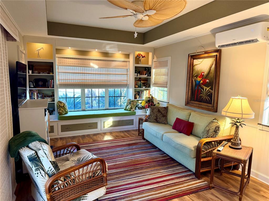 9564 Southeast 47th Way Webster, FL 33597 - Photo 12 of 40 a living room with furniture and a bathtub