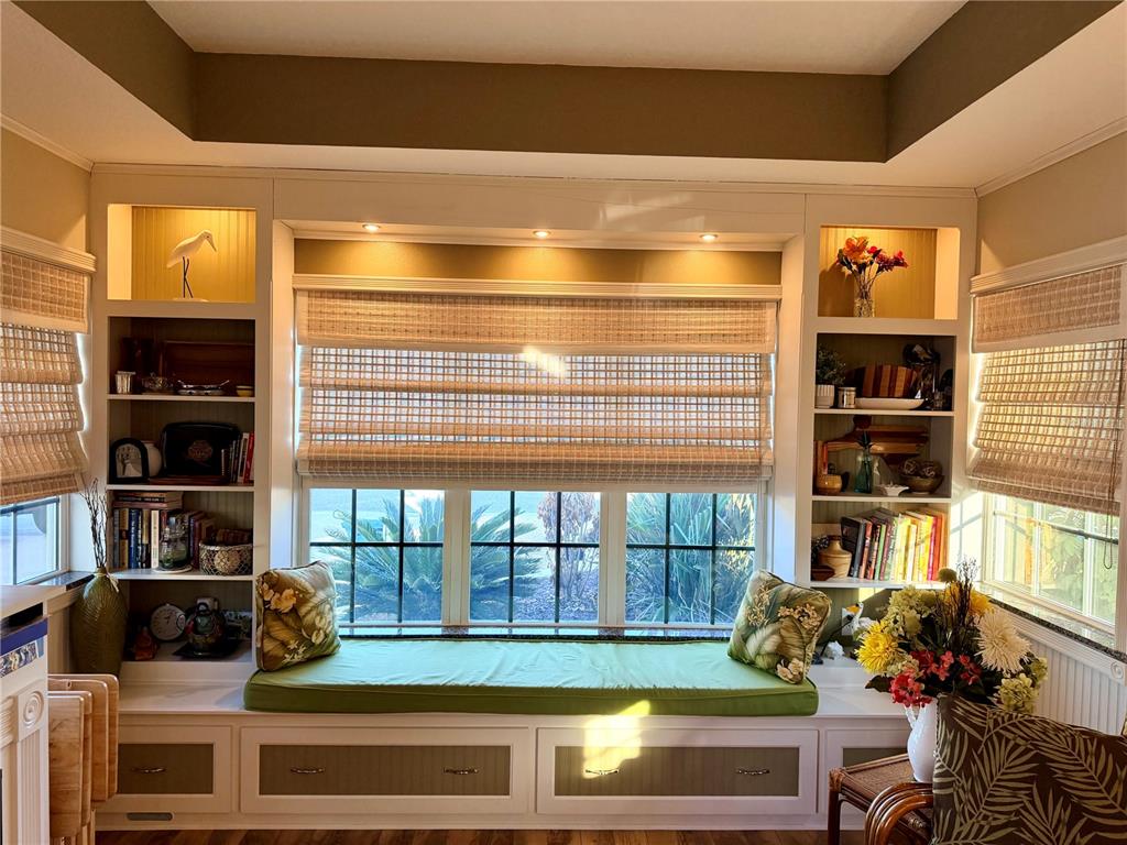 9564 Southeast 47th Way Webster, FL 33597 - Photo 14 of 40 a living room with furniture and a floor to ceiling window