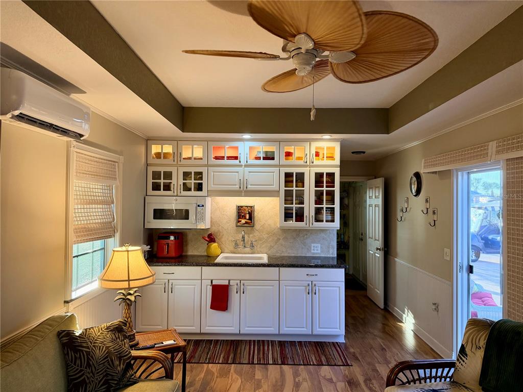 9564 Southeast 47th Way Webster, FL 33597 - Photo 15 of 40 a kitchen with stainless steel appliances granite countertop a stove and cabinets
