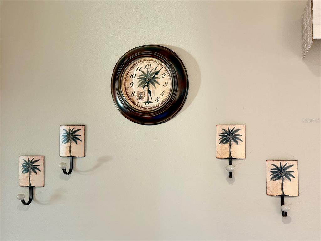 9564 Southeast 47th Way Webster, FL 33597 - Photo 16 of 40 a view of a storage & utility room with racks on the wall