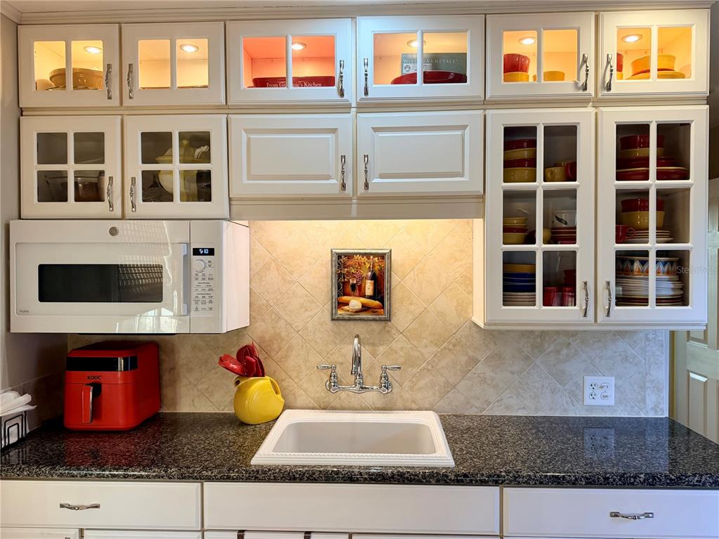 9564 Southeast 47th Way Webster, FL 33597 - Photo 17 of 40 a front view of a house with a yard