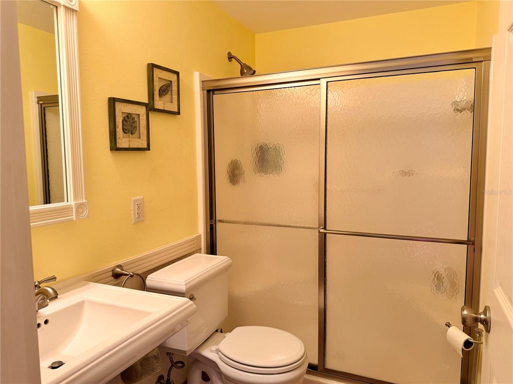 9564 Southeast 47th Way Webster, FL 33597 - Photo 20 of 40 a bathroom with a sink mirror vanity and toilet
