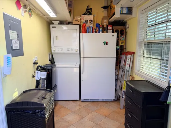 a white refrigerator freezer sitting in a kitchen