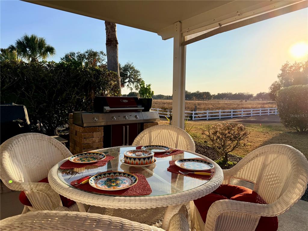 9564 Southeast 47th Way Webster, FL 33597 - Photo 25 of 40 a living room with furniture and a floor to ceiling window