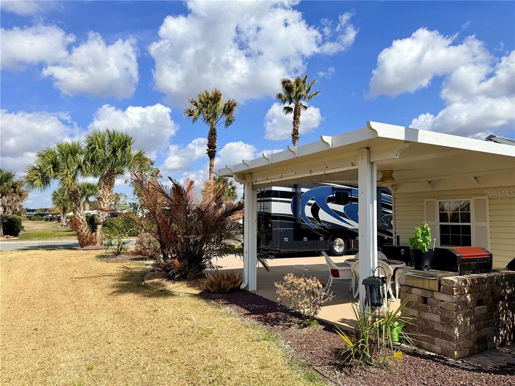 9564 Southeast 47th Way Webster, FL 33597 - Photo 10 of 40 a view of a porch with potted plants