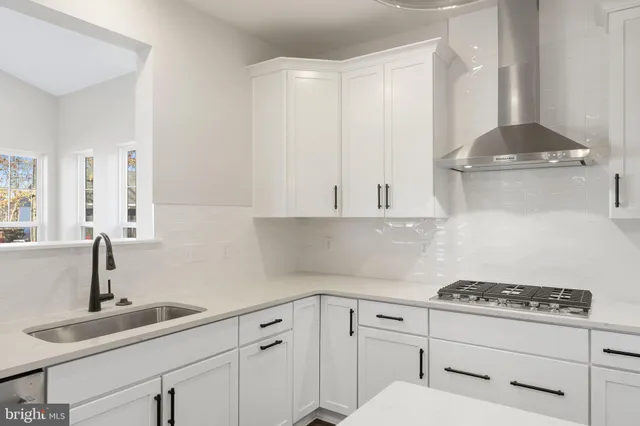a bathroom with a shower sink and mirror