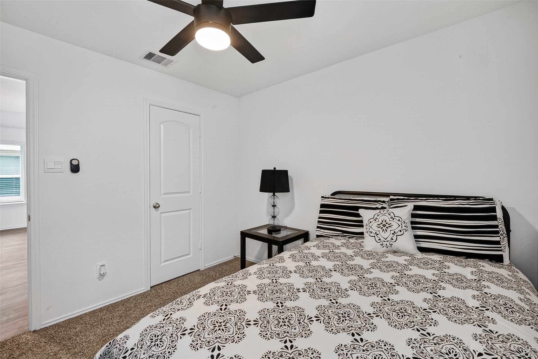 24318 Pebble Crescent Ln Spring Spring, TX 77373 - Photo 22 of 30 Spacious secondary bedroom featuring great natural light, ample closet space, and versatile functionality perfect for family, guests, a home office, or flex space.
