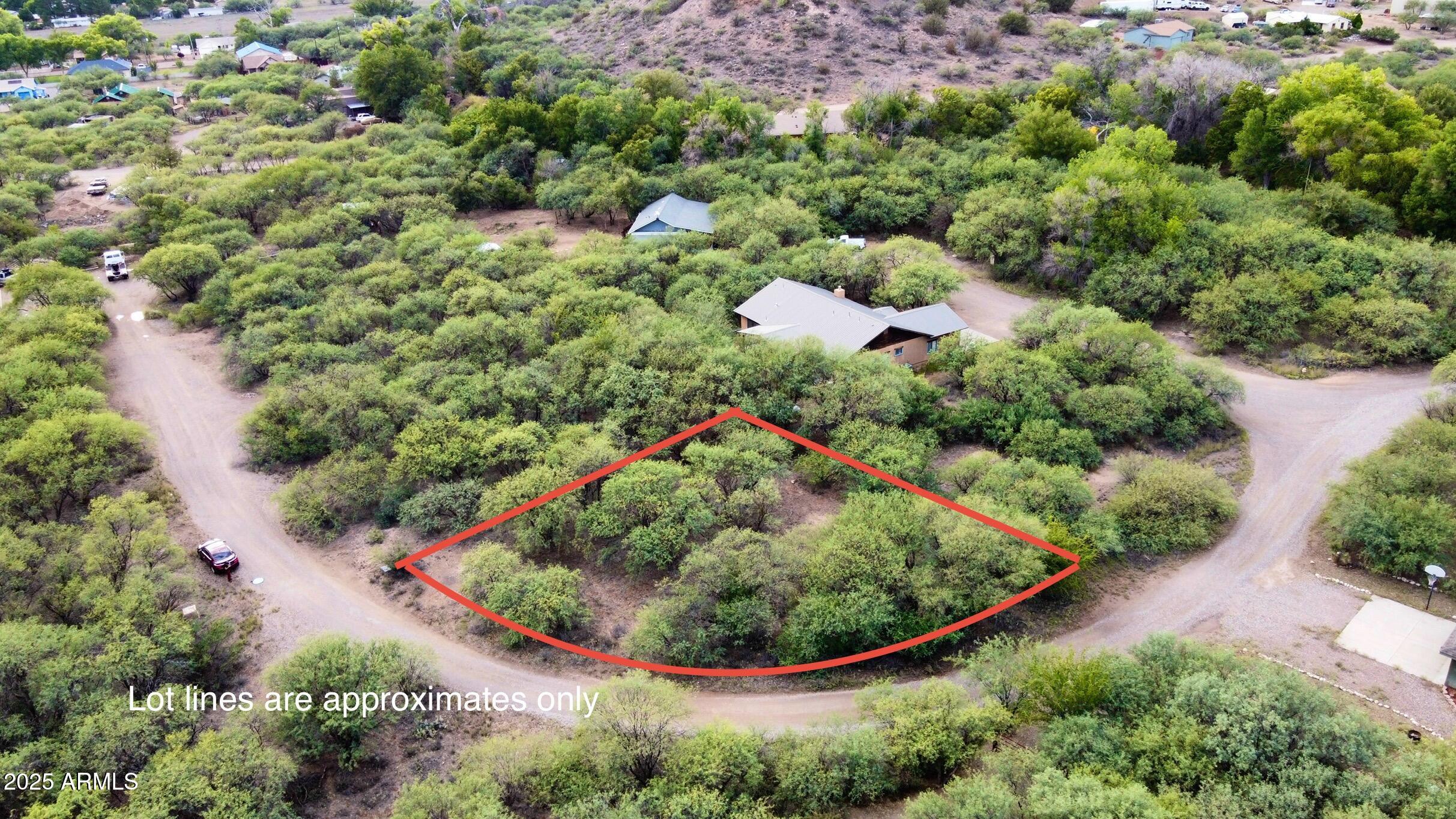 5380 North Barbara Lane, Unit 631 Rimrock, AZ 86335 - Photo 2 of 18 an aerial view of a house with a yard and outdoor seating
