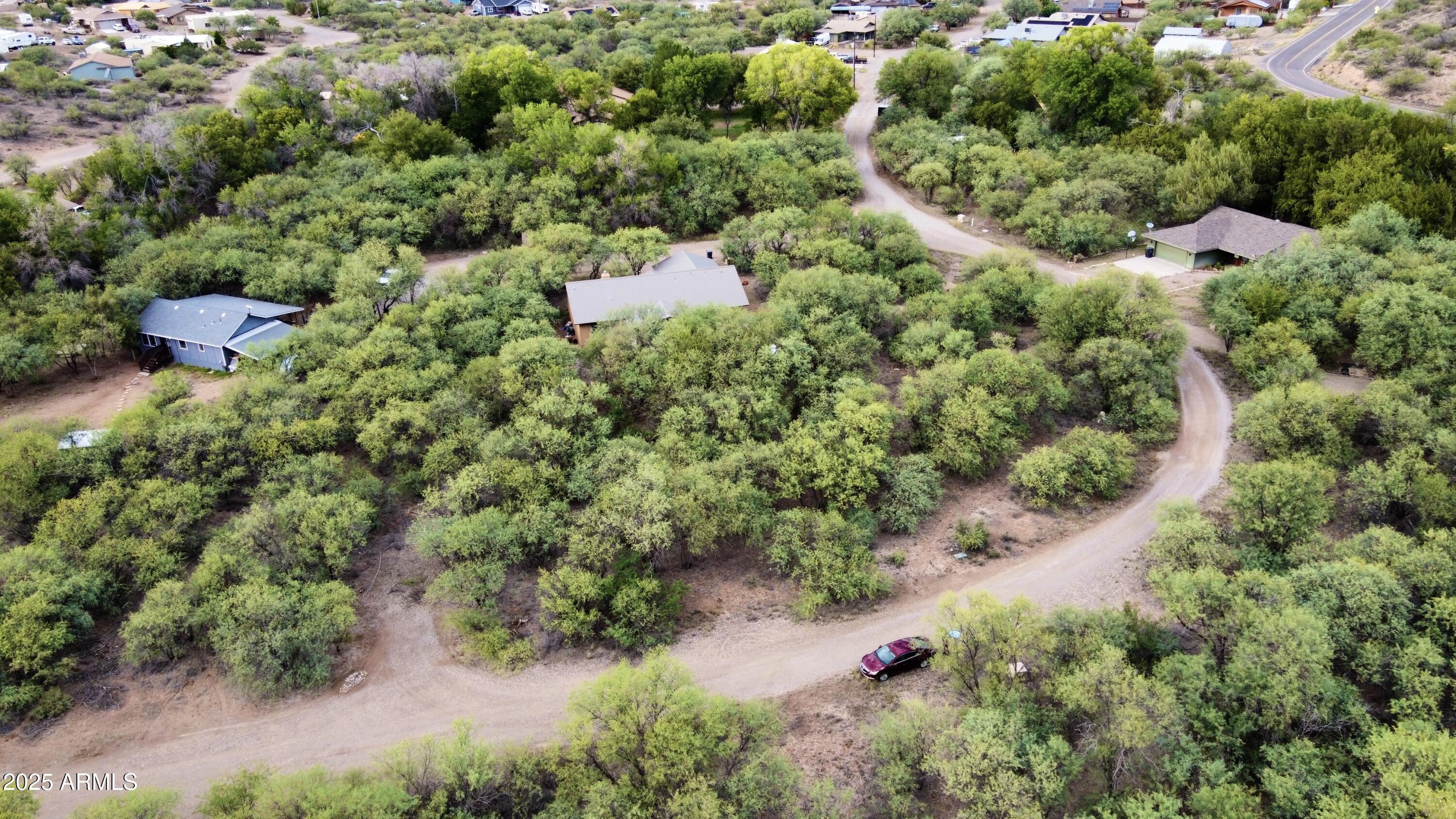 5380 North Barbara Lane, Unit 631 Rimrock, AZ 86335 - Photo 3 of 18 an aerial view of residential house with outdoor space and trees all around