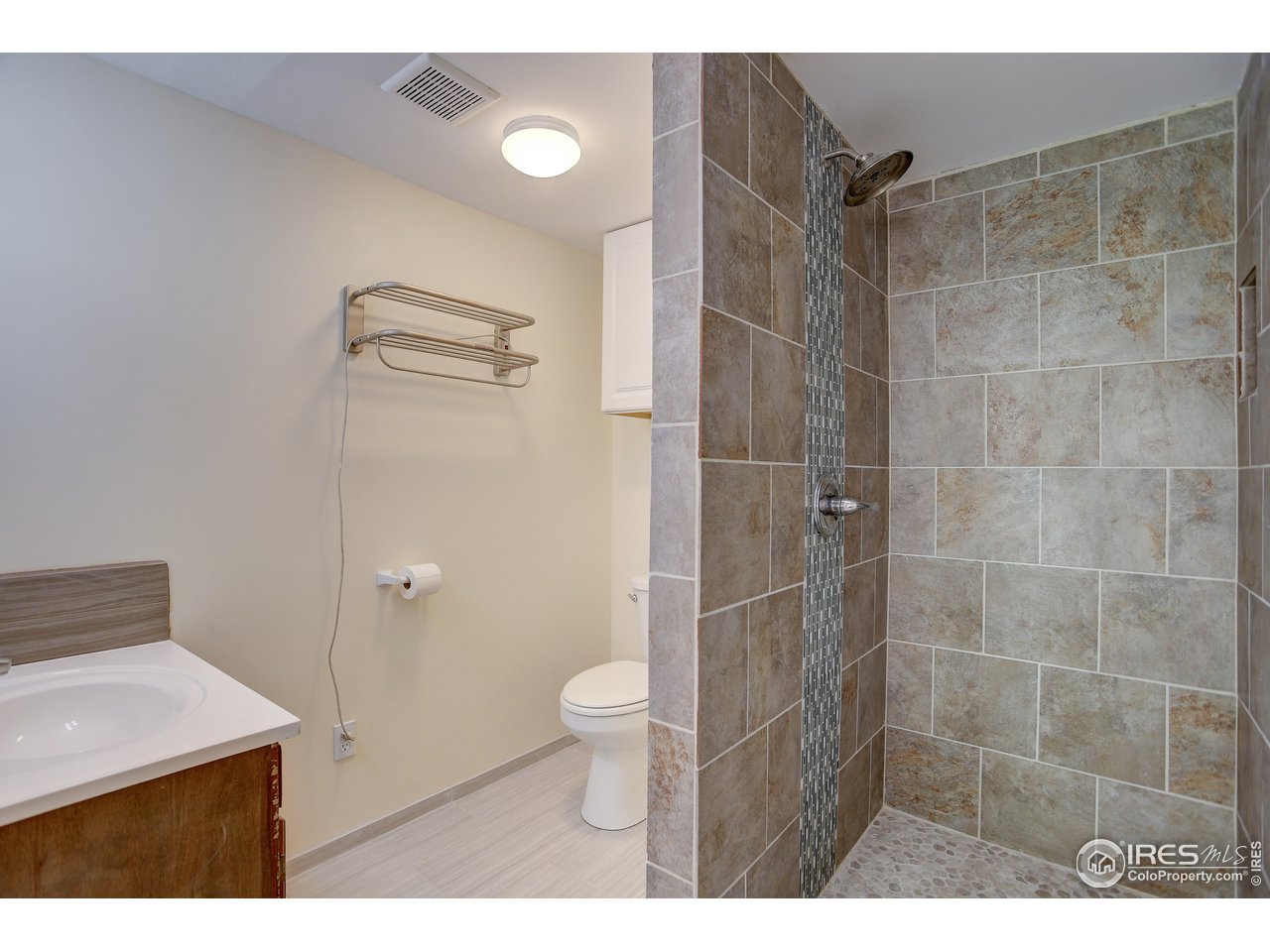 35 Boston Street Ward, CO 80481 - Photo 19 of 34 a bathroom with a granite countertop sink toilet and shower