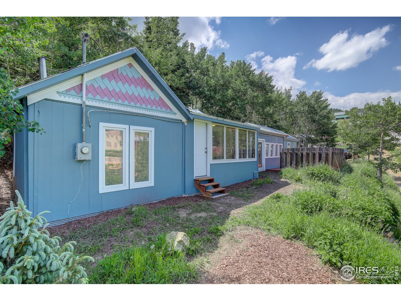 35 Boston Street Ward, CO 80481 - Photo 2 of 34 a view of backyard of house with deck and seating space