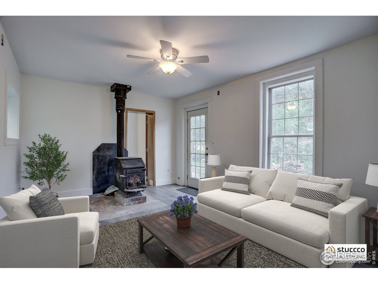 35 Boston Street Ward, CO 80481 - Photo 7 of 34 a living room with furniture a chandelier and a window