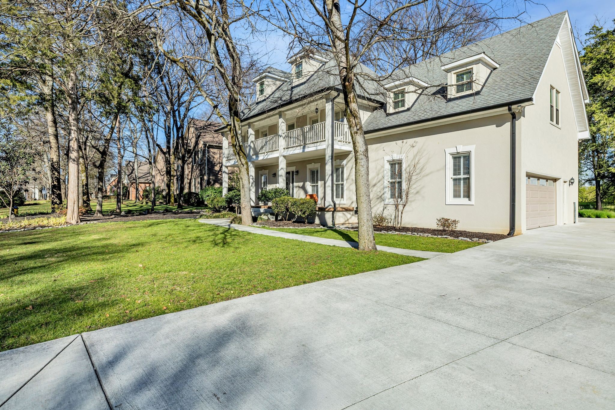 1810 Waterford Road Murfreesboro, TN 37129 - Photo 4 of 43 a view of a white house with a big yard and palm trees