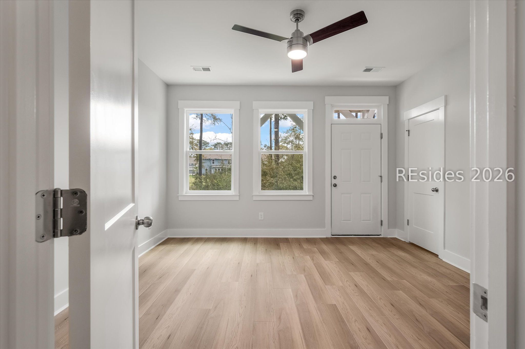 423 East Parkside Cmns Bluffton, SC 29910 - Photo 7 of 34 Lower level bedroom with patio access
