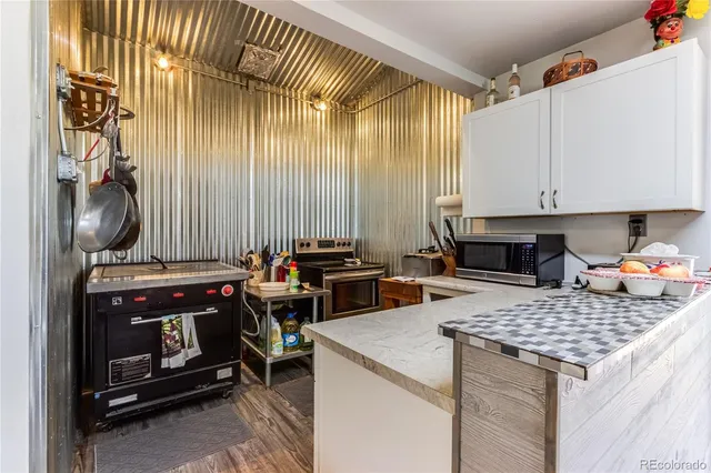 a kitchen with a stove a sink and a refrigerator