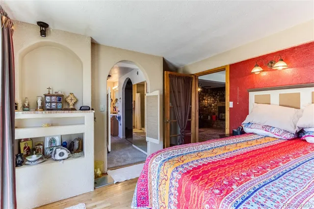 a bedroom with a bed and a table