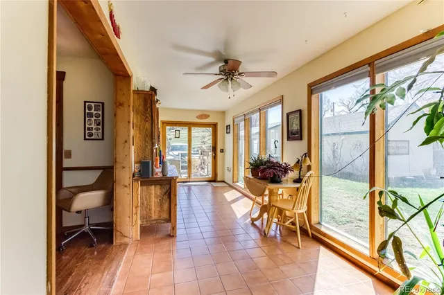 a view of a dining room with furniture window and outside view
