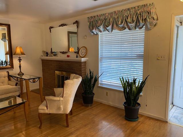 212 Iris Drive Salinas, CA 93906 - Photo 3 of 8 a dining room with furniture and potted plants