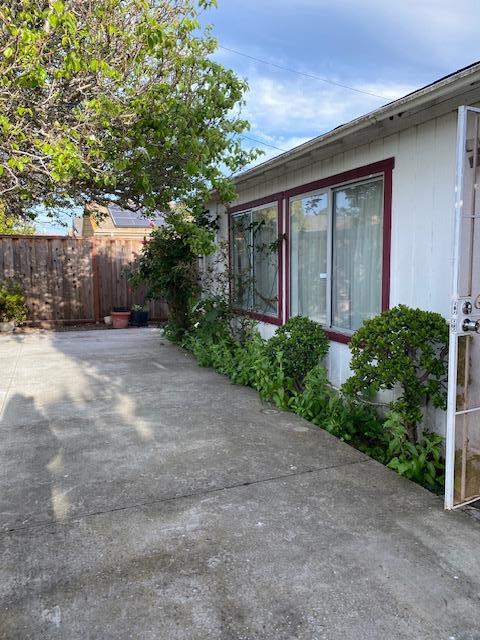 212 Iris Drive Salinas, CA 93906 - Photo 7 of 8 a view of a house with a small yard and garage