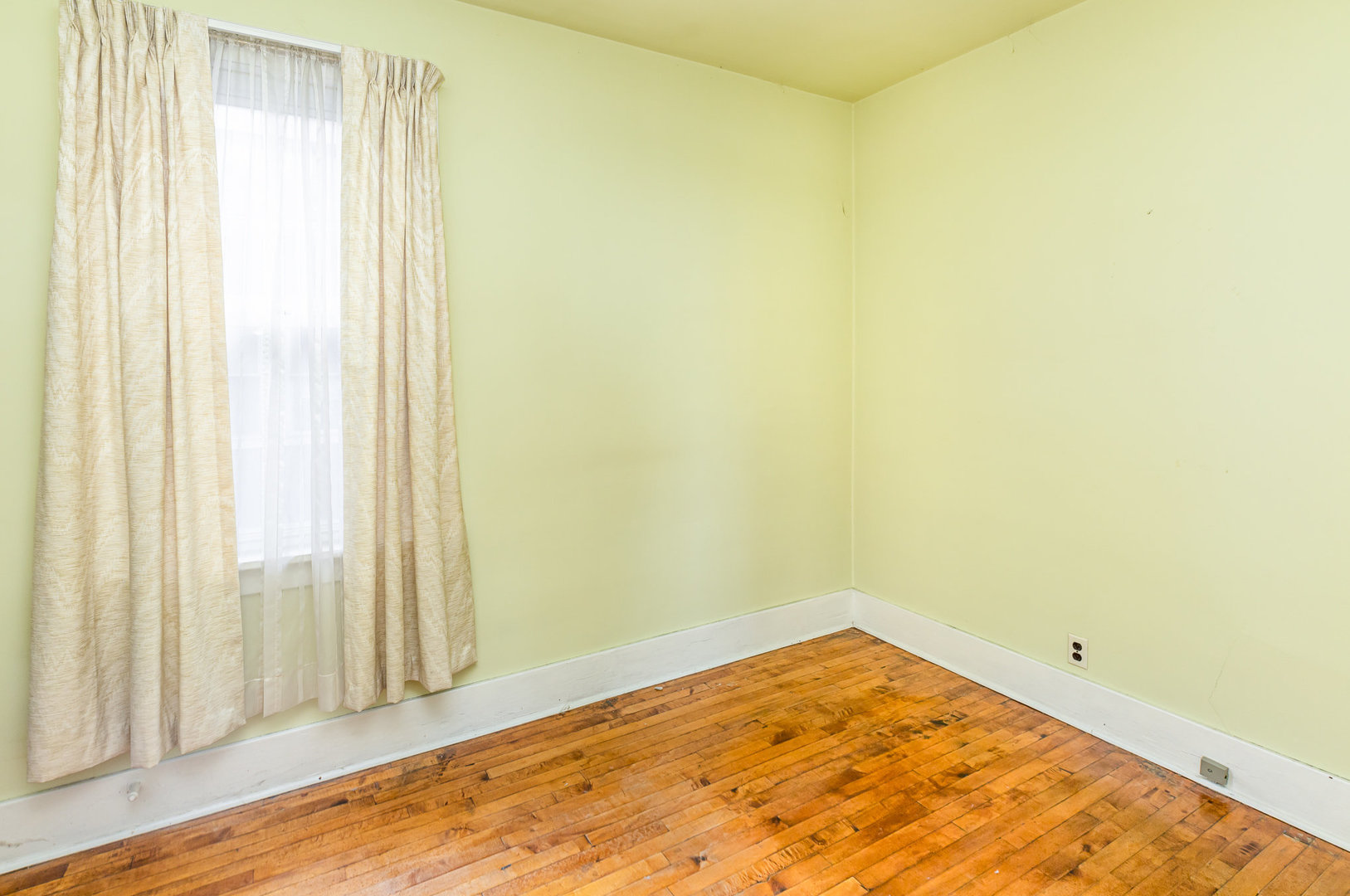 2723 Indiana Avenue Lansing, IL 60438 - Photo 12 of 18 a view of a room with a wooden floor and a window
