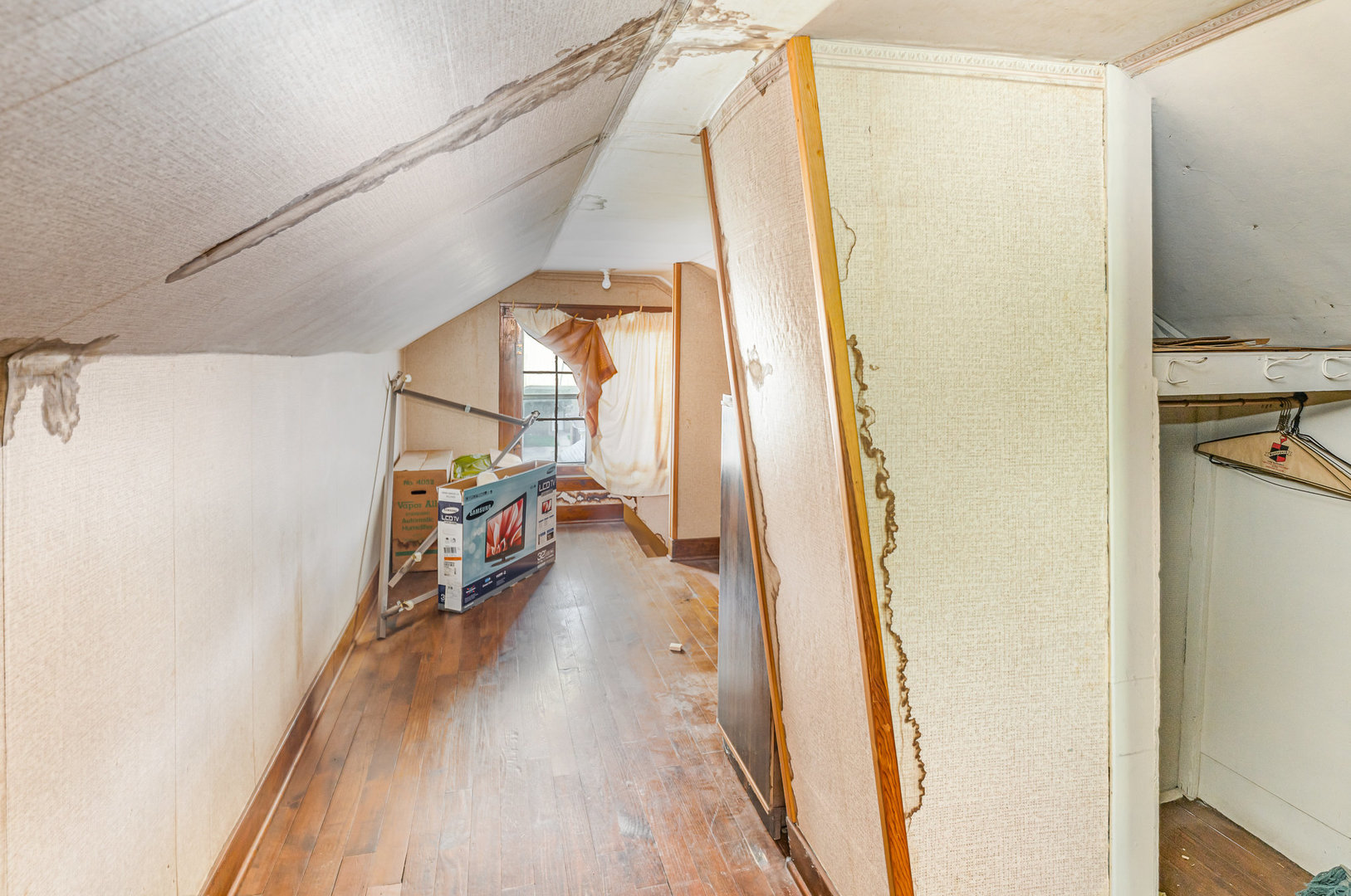2723 Indiana Avenue Lansing, IL 60438 - Photo 16 of 18 a view of a hallway with wooden floor and stairs