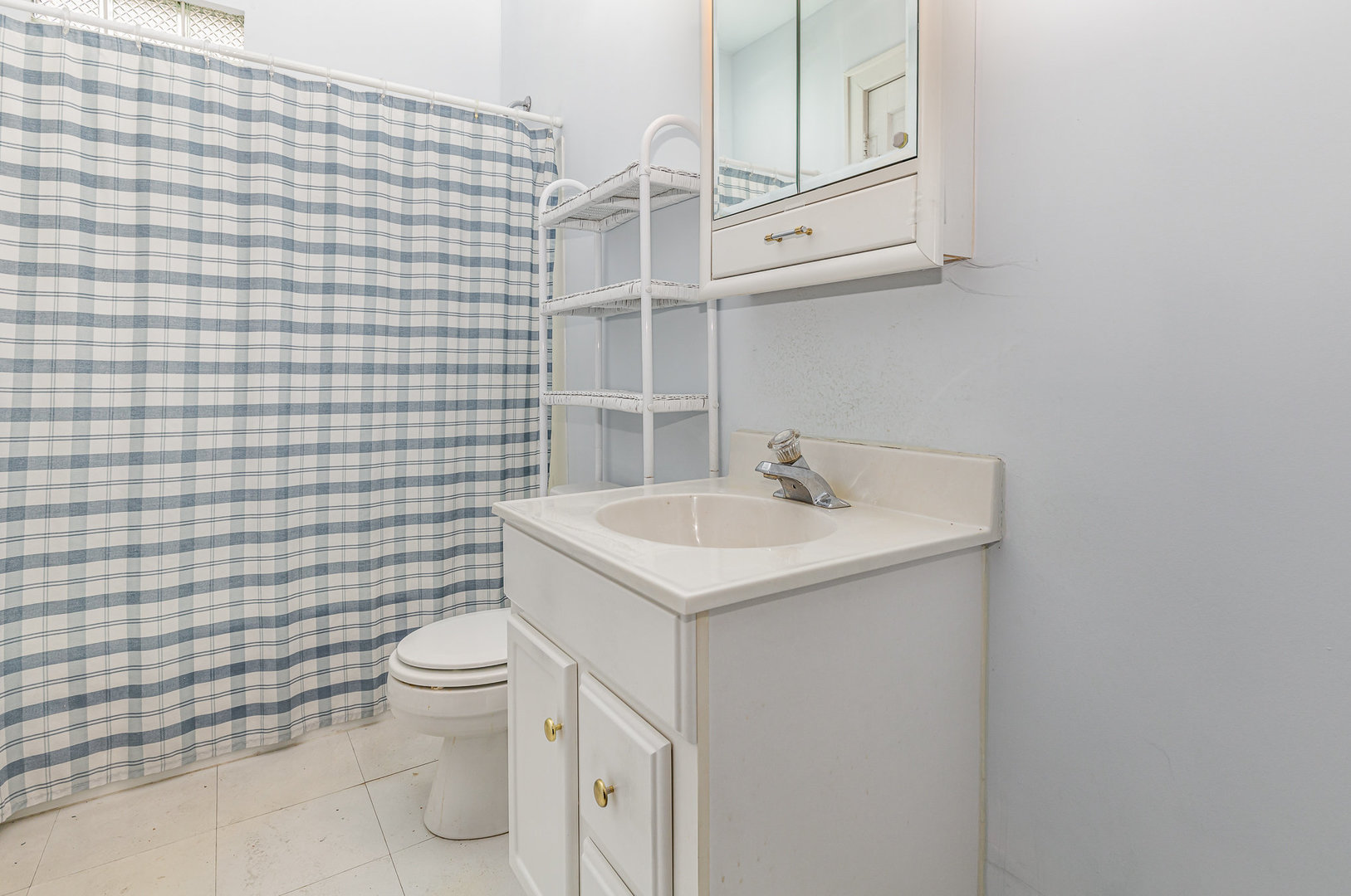 2723 Indiana Avenue Lansing, IL 60438 - Photo 17 of 18 a bathroom with a sink a toilet and shower
