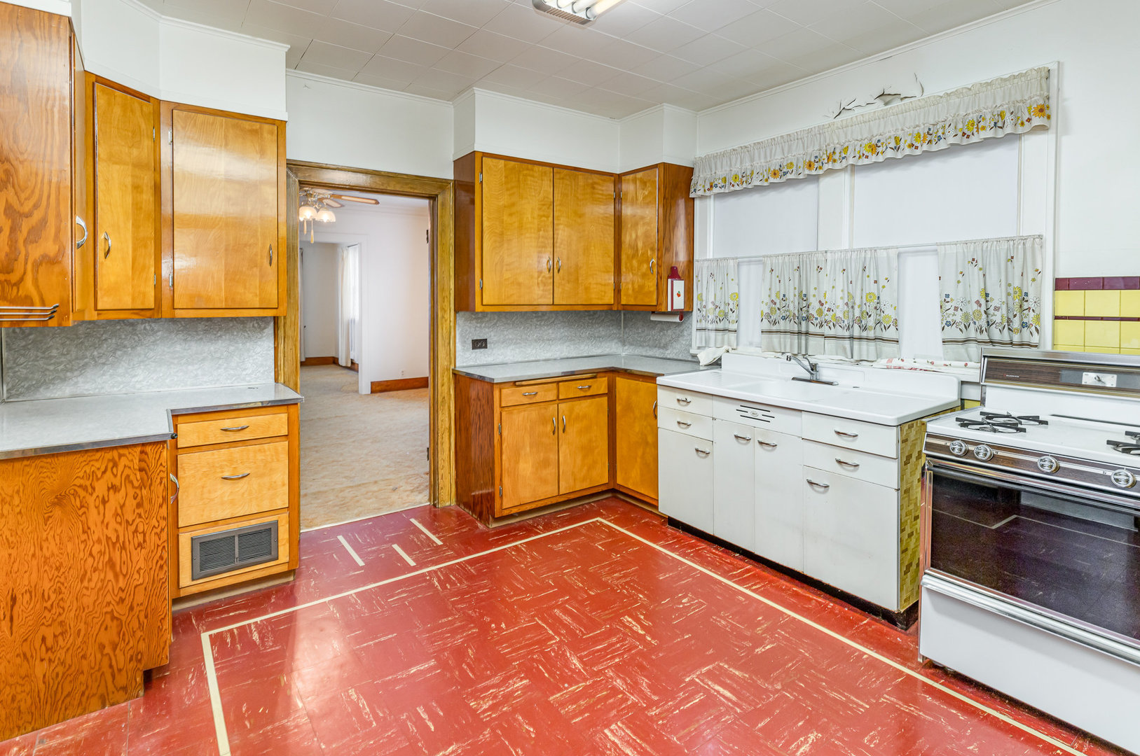 2723 Indiana Avenue Lansing, IL 60438 - Photo 9 of 18 a kitchen with stainless steel appliances granite countertop a sink stove and refrigerator