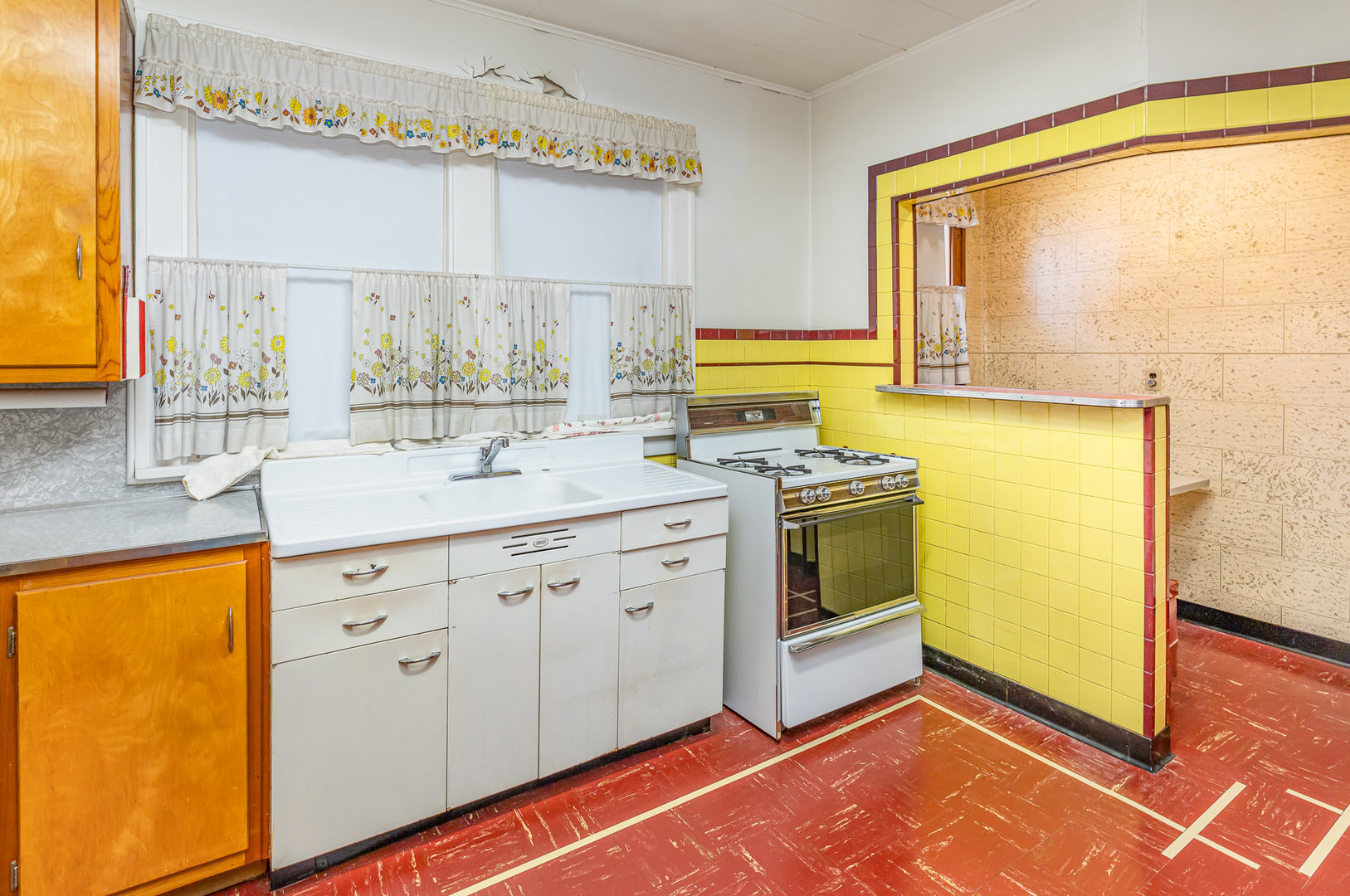 2723 Indiana Avenue Lansing, IL 60438 - Photo 10 of 18 a kitchen with stainless steel appliances a stove a sink and a microwave