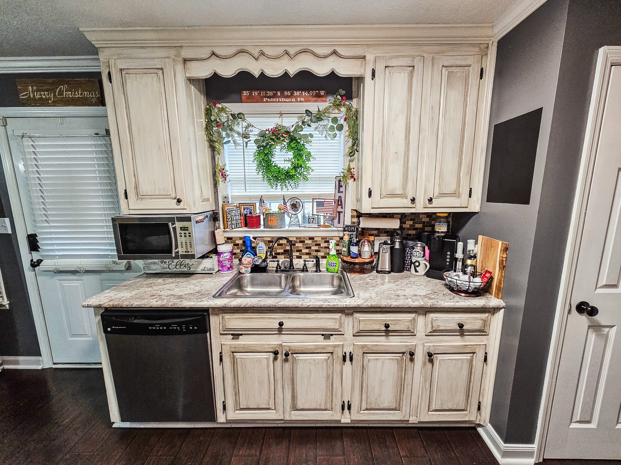 16 Volunteer Road Petersburg, TN 37144 - Photo 11 of 41 a kitchen with stainless steel appliances granite countertop a stove a sink and a microwave