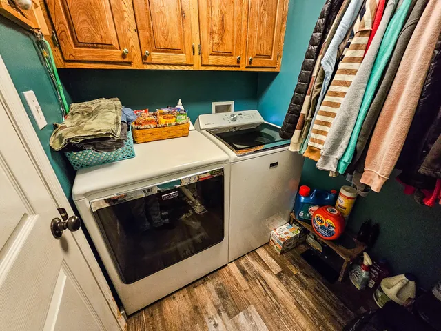 a view of a field with trees in the background