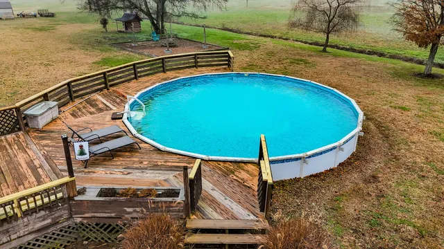 a view of a field with trees