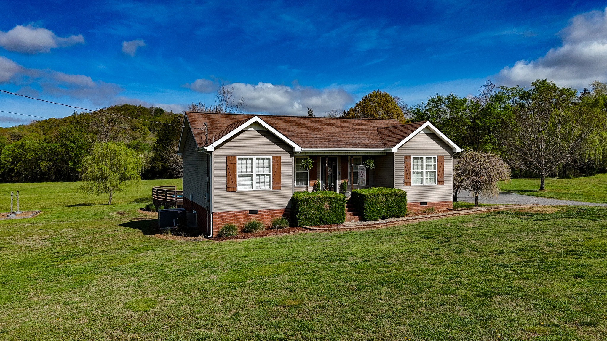 16 Volunteer Road Petersburg, TN 37144 - Photo 3 of 41 a front view of a house with yard and green space