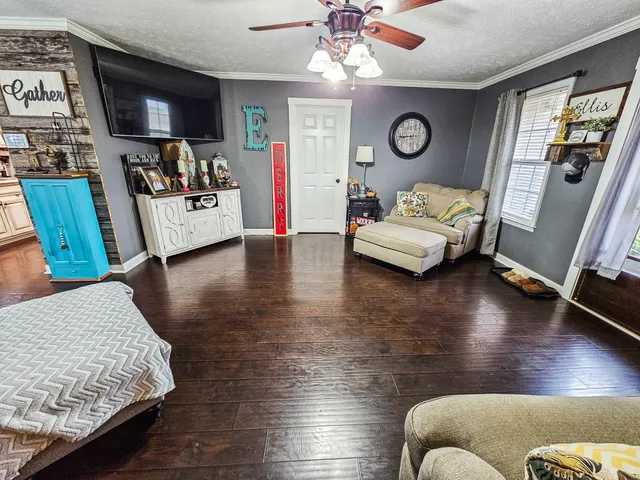 a living room with furniture and a flat screen tv