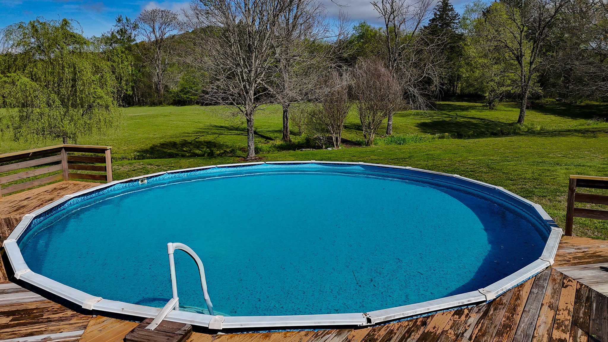 16 Volunteer Road Petersburg, TN 37144 - Photo 32 of 41 a view of a swimming pool with a patio and a yard