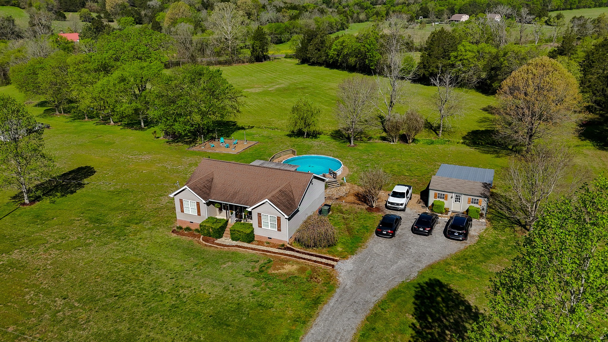 16 Volunteer Road Petersburg, TN 37144 - Photo 35 of 41 an aerial view of a house with garden space and outdoor seating