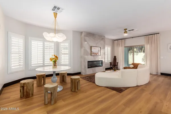 a kitchen with stainless steel appliances granite countertop a sink a stove and a refrigerator