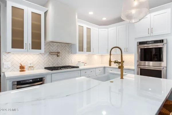 a close up of a white stove top oven