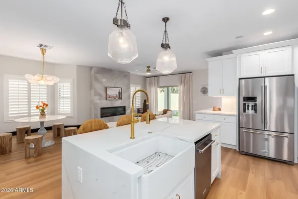 a spacious bedroom with a bed and wooden floor