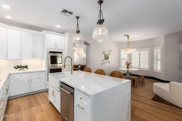 a bath room with a shower and a sink