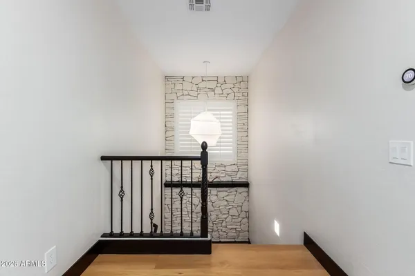 an empty room with a empty space and a ceiling fan