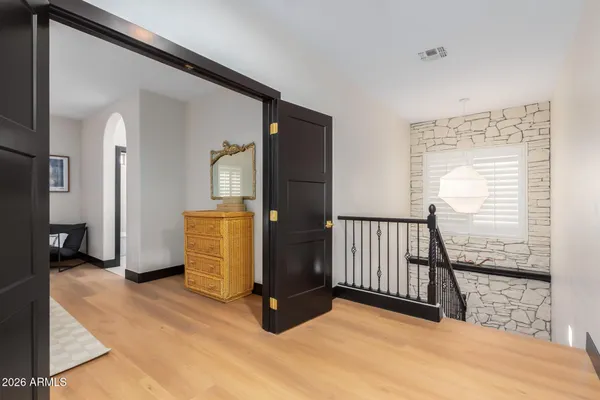 an empty room with a ceiling fan and a window