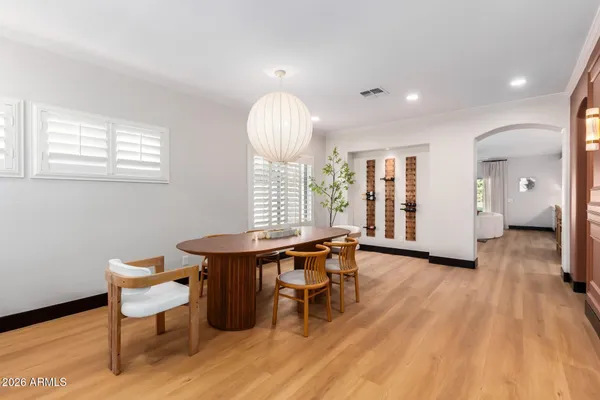 a view of a dining room with furniture and wooden floor