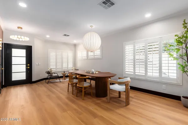 a view of a livingroom with furniture window and wooden floor