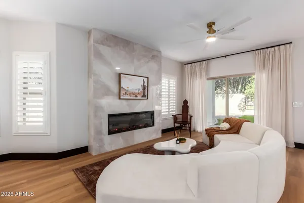 a living room with furniture and a fireplace